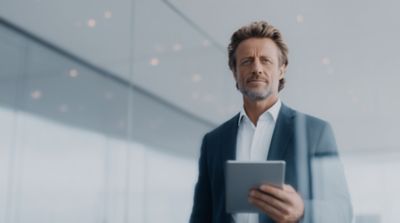 Team meeting in the office, Self-insurance solutions | DXC Technology