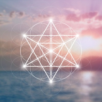 Merkaba sacred geometry spiritual new age futuristic illustration with interlocking circles, triangles and glowing particles in front of colorful blurry natural photographic background