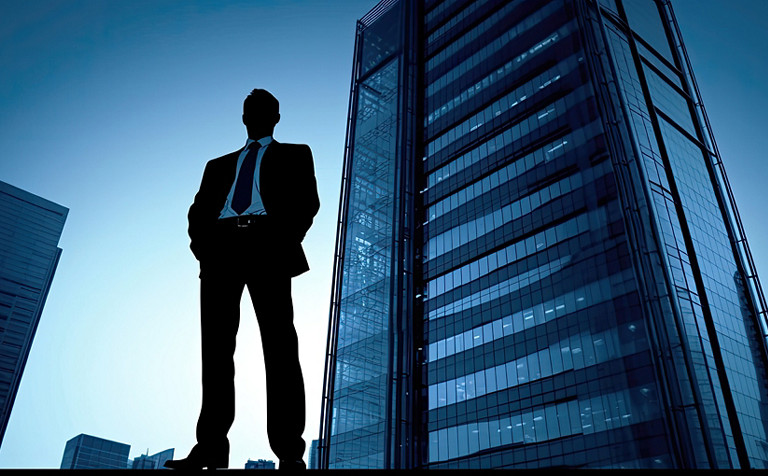 Businessman in front of buildings