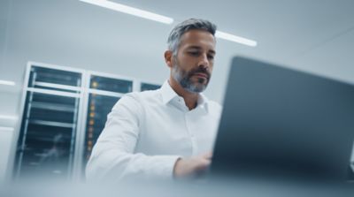 man working on private ai implementation, Private AI | DXC Technology