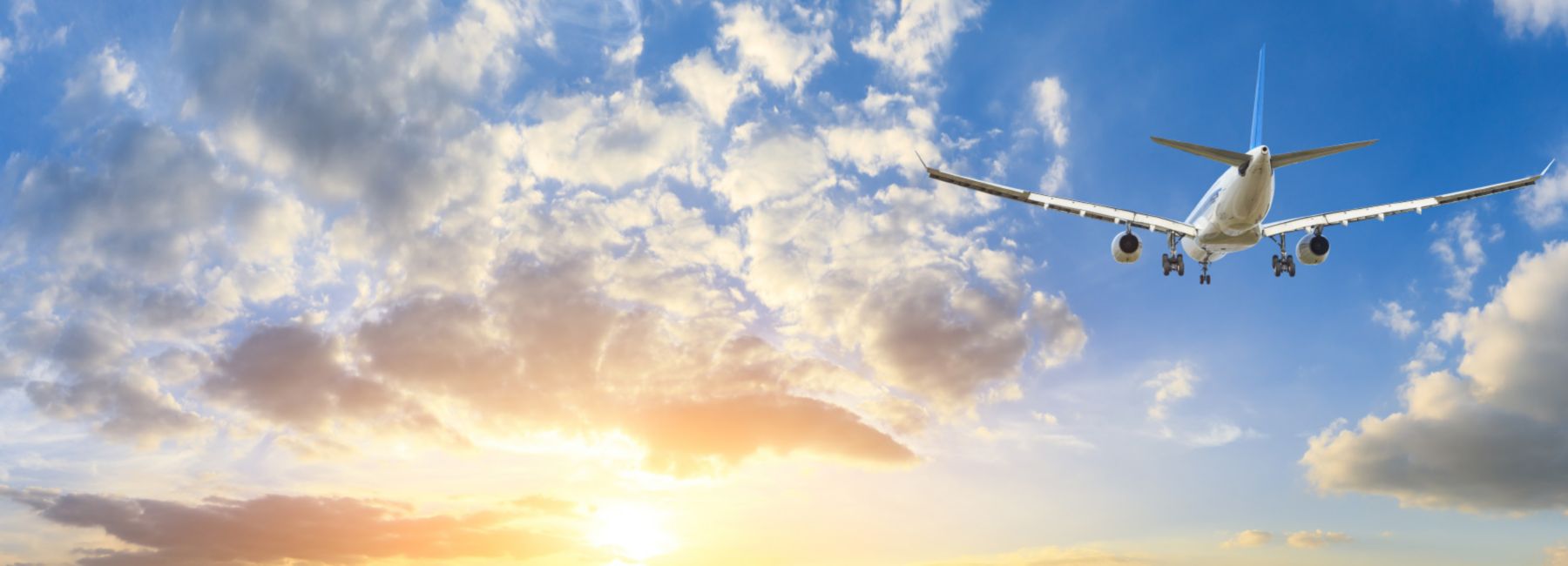 Airplane in the sky at sunrise