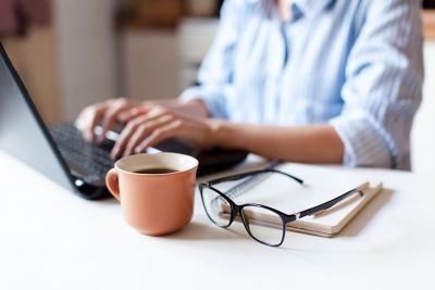 Woman working at laptop, Dell Technologies | DXC Technology