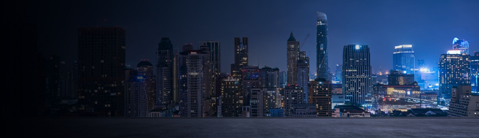 Dark background with faint grid patterns in lights, Staying ahead of cyberthreats in Asia-Pacific | DXC Technology