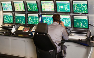 12 Mar 2012 --- Man working in security control room --- Image by © Hybrid Images/cultura/Corbis