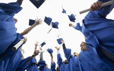 Graduates throwing caps in the air