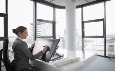 Architect working on digital tablet --- Image by Â© John Smith/Corbis